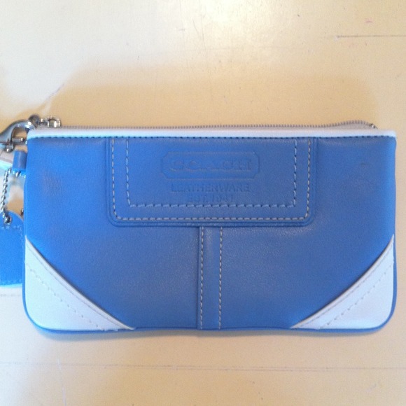 Authentic new Coach blue & white leather wristlet.