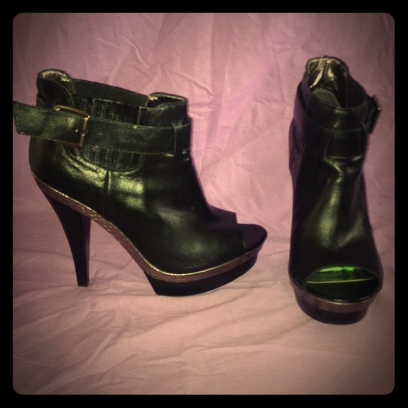 Black leather booties with side buckle.