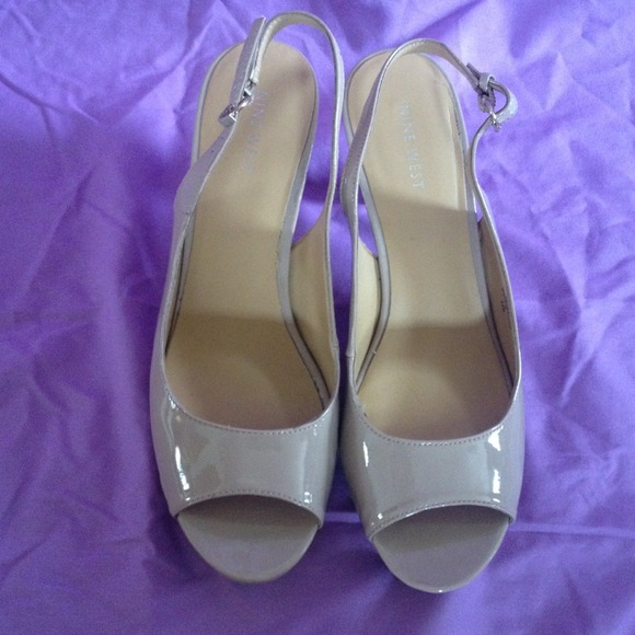 Taupe patten leather strap heel pumps.