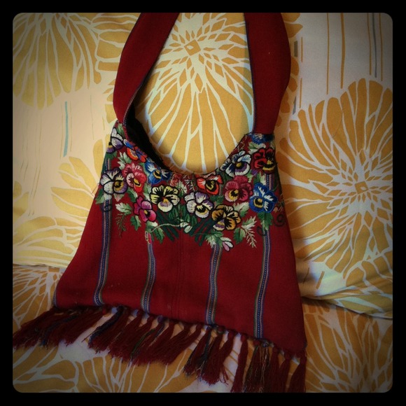 Red embroidered flower purse.
