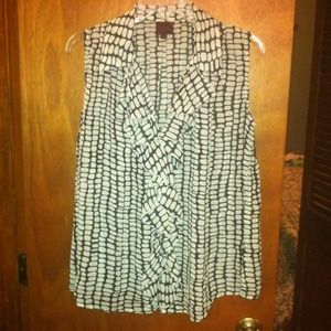 Black & white sleeveless top with ruffle front.