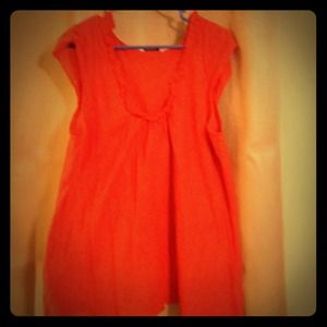 Bright orange sleeveless top