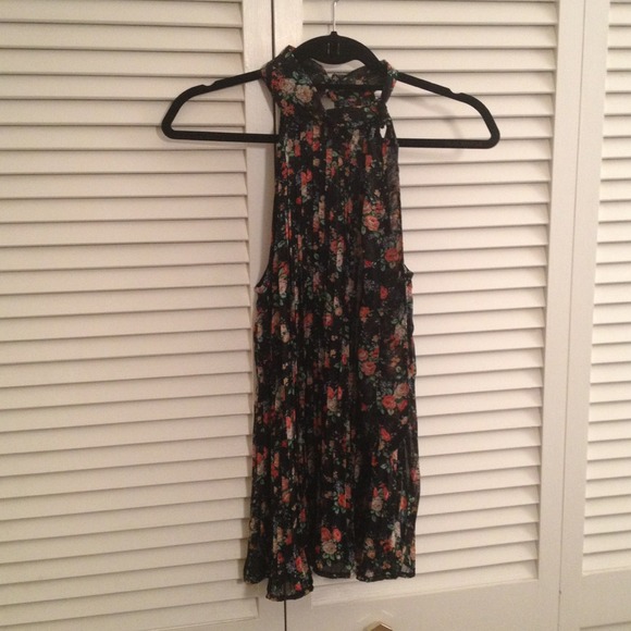 Sheer blk floral top with tie scarf on the neck.