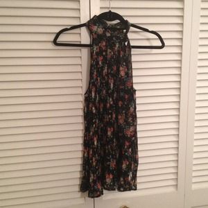 Sheer blk floral top with tie scarf on the neck.