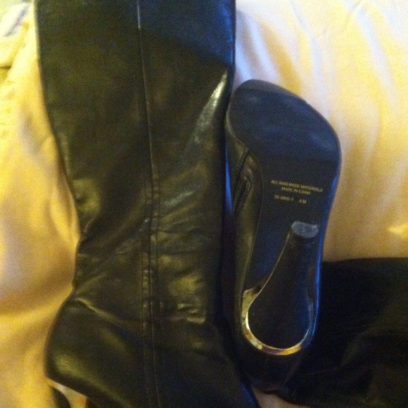 Boots.  Tall shaft zipper sides.