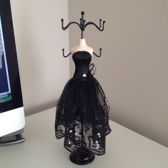 Jewelry holder wearing fancy black dress