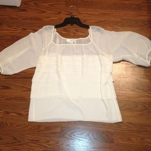 Cream colored, sheer on the top