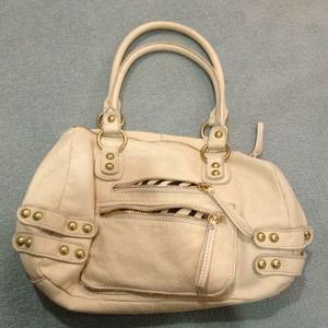Cream colored leather purse with gold hardware