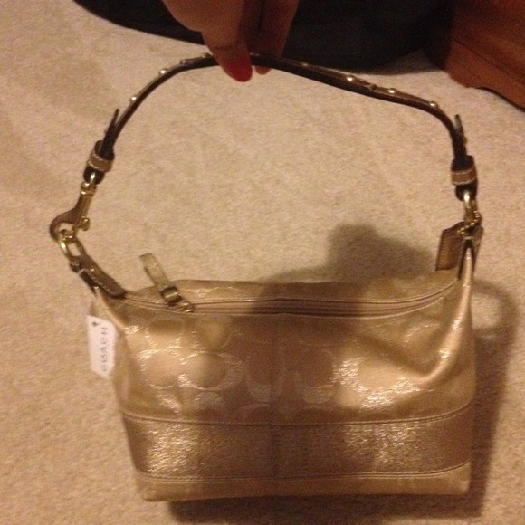 SOLD! NWT gold coach bag