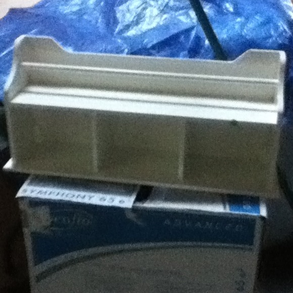 Bathroom shelf that holds towles and nick nacks