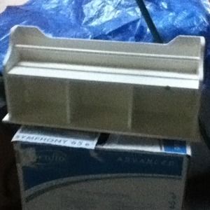 Bathroom shelf that holds towles and nick nacks