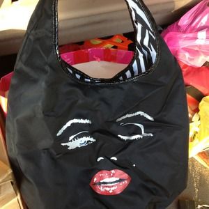 This pretty Betsey Johnson bag needs a new home.