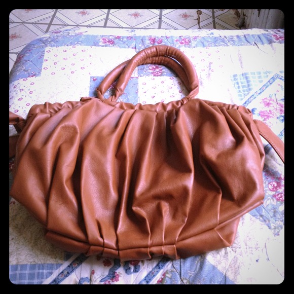 Brown shoulder purse with bows on the side
