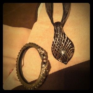 Tear drop piece with double headed snake bracelet.