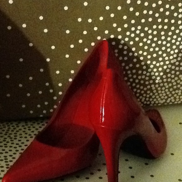 Red patent pumps