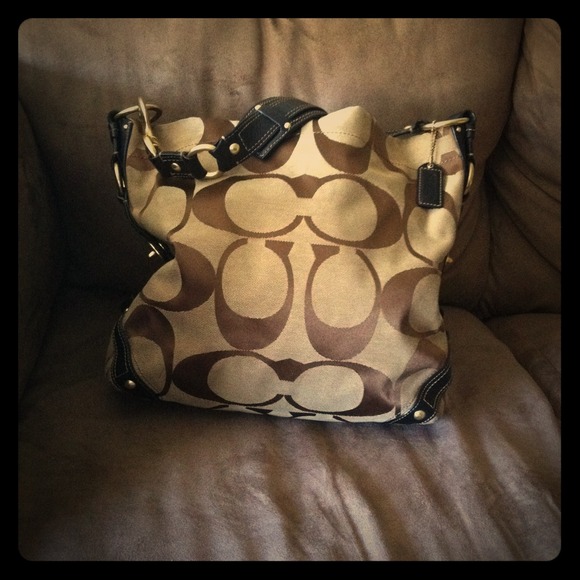 Coach bag. Black mechanics on brown.