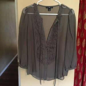 Sheer grey blouse with ruffles.