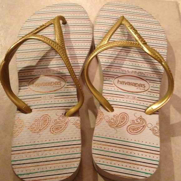 Havaianas white and gold flip flops