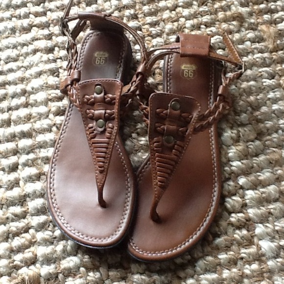 Brown flat sandals.