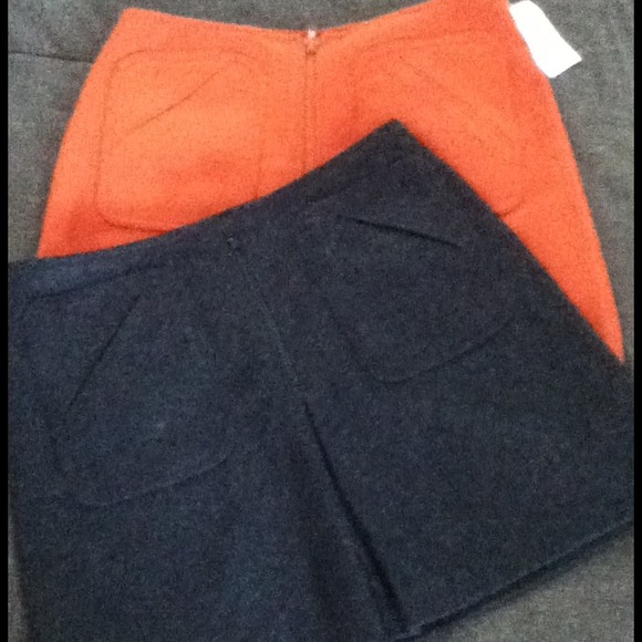 2  mid thigh length skirts (Can be sold separate)