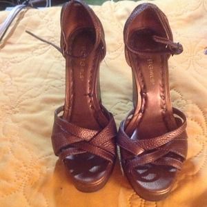 Gently worn bronze colored platforms