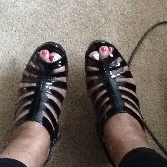Black patent leather peep toe pumps