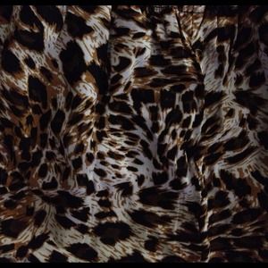 Animal print romper. Small with a ruffle top.