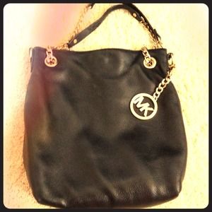 Reserved.. Michael kors black leather bag