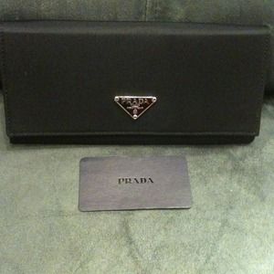Prada Clutches & Wallets - PRADA black wallet pictures added not authentic Prada Clutches & Wallets - PRADA black wallet pictures added not authentic