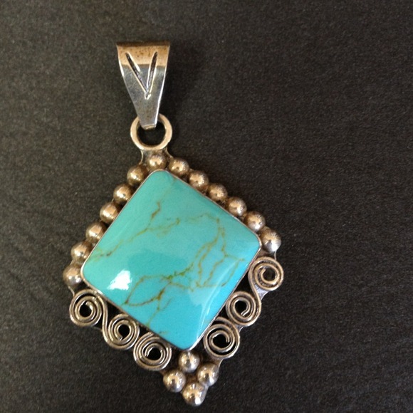 Turquoise and sterling silver pendant.