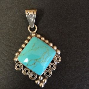 Turquoise and sterling silver pendant.