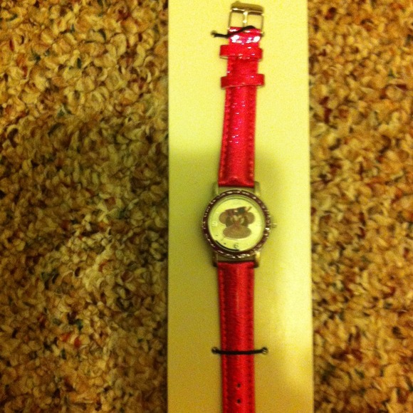 Pink watch with monkey on face