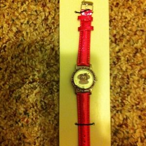 Pink watch with monkey on face