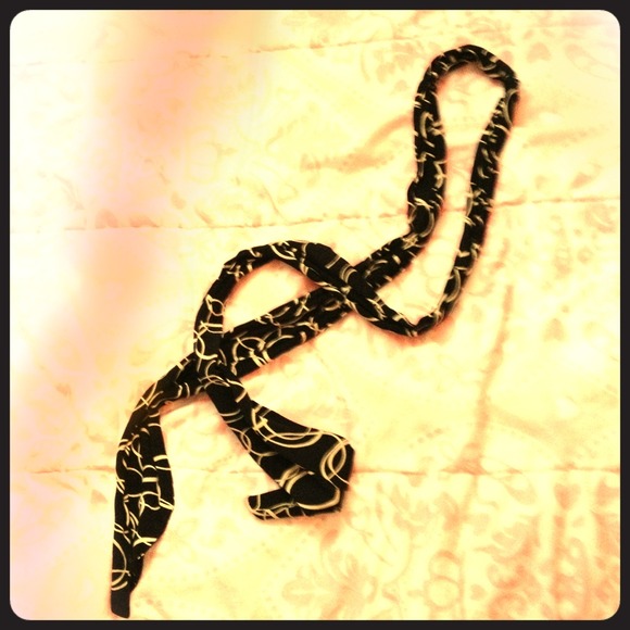 Black and white belt, headband, sash, scarf.