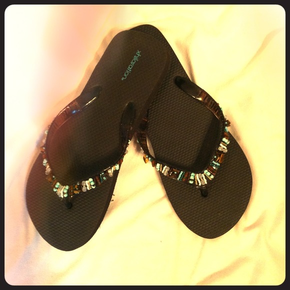 Brown flip flops.