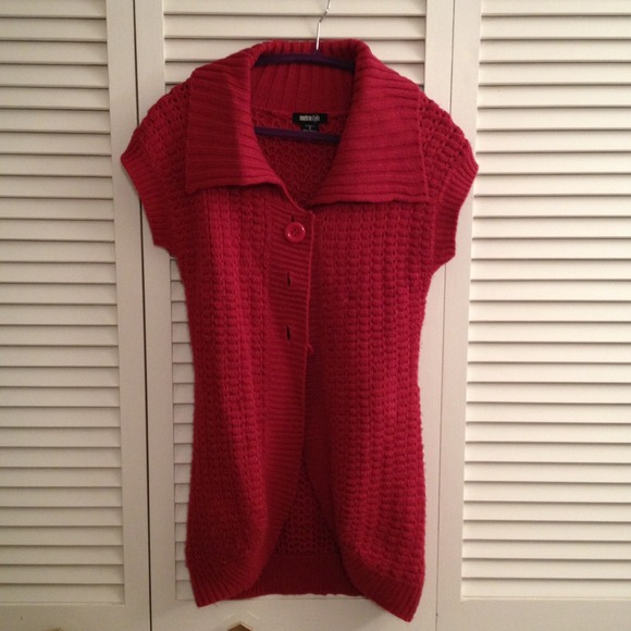 Raspberry colored button down sweater.
