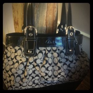 Black patent leather and fabric coach bag diaper