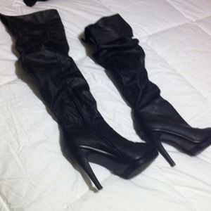 Black below the knee or knee high boots