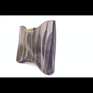 Alexander McQueen's patent-leather clutch