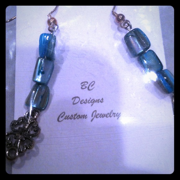 Custom handmade "BC Designs" teal heart earrings!