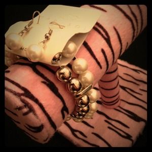 New pearl bracelet with matching earrings .