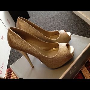 Gold open toe pumps