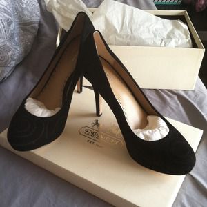 Coach pumps size 9.5 brand new. Never worn.