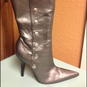 Pewter color button up boots.