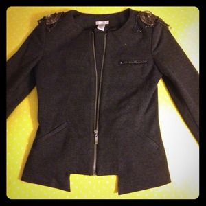 Cute suit jacket with detailed shoulders.