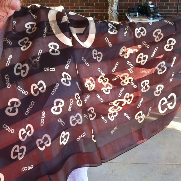 Large scarf with Gucci name on it