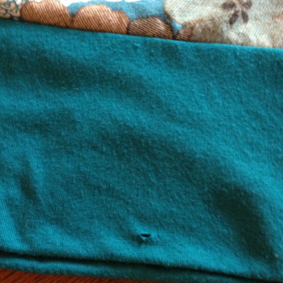 The rip is at the bottom left front 😔