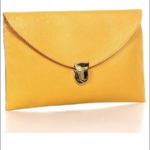 yellow clutch with long gold chain strap