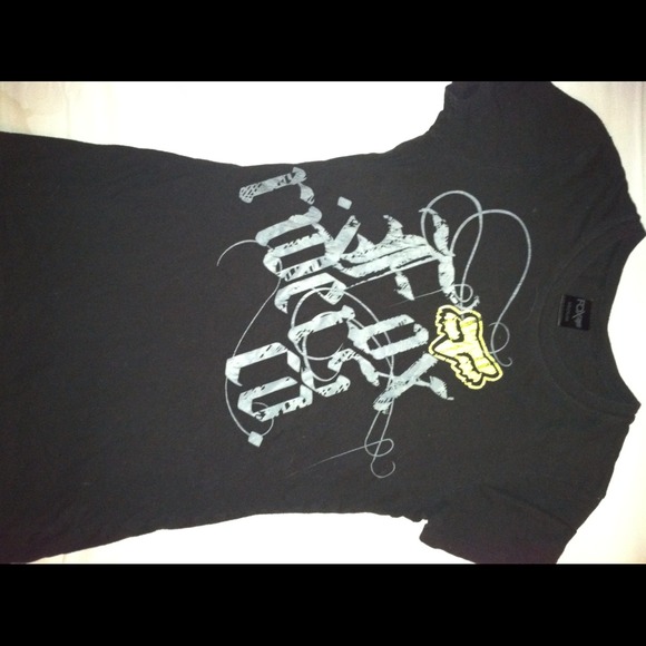 Fox tee. Black with green lettering.