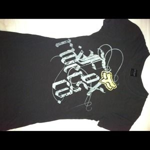 Fox tee. Black with green lettering.